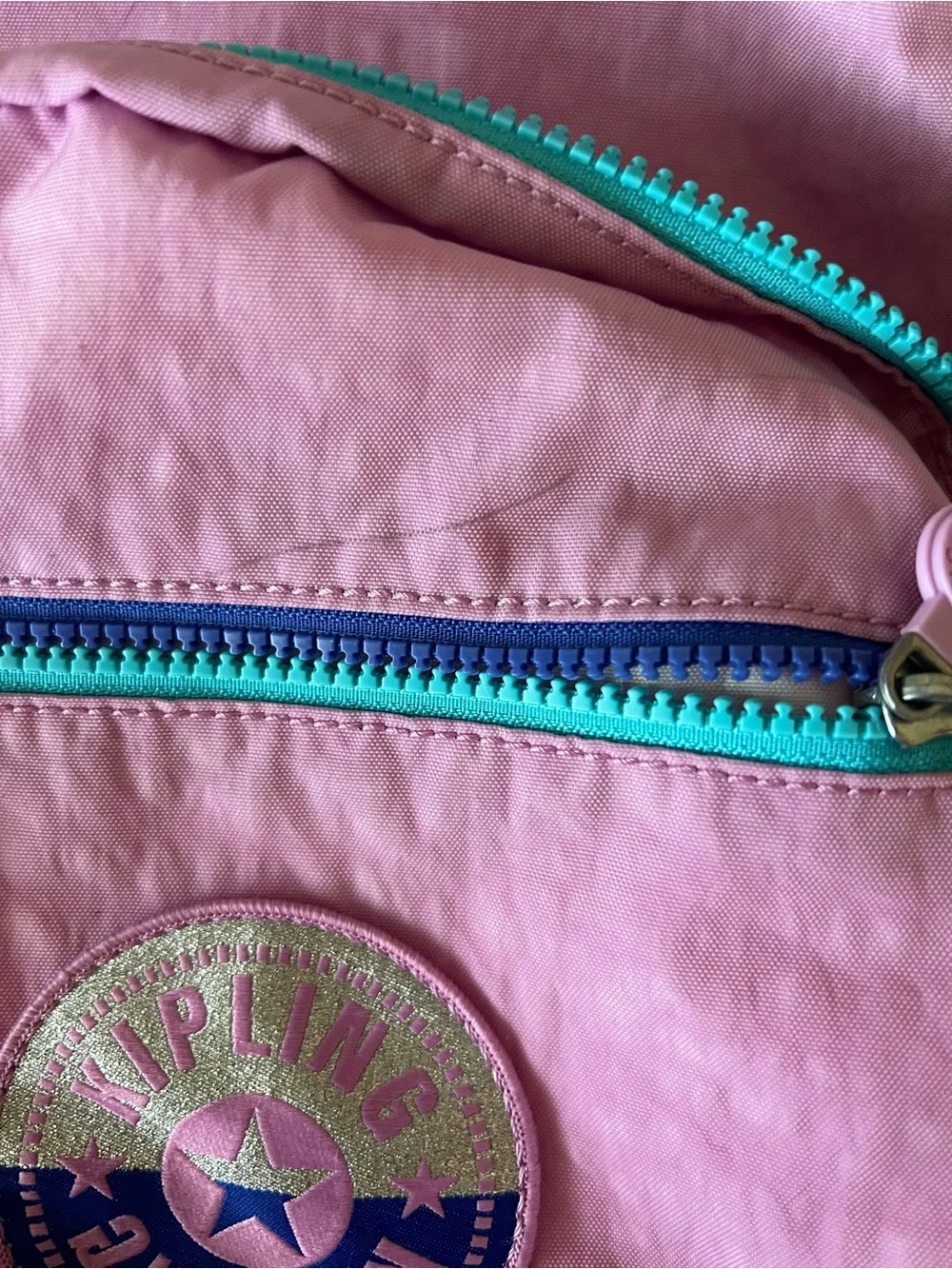 Kipling Pink standard Backpack with Teal and Purple Accents